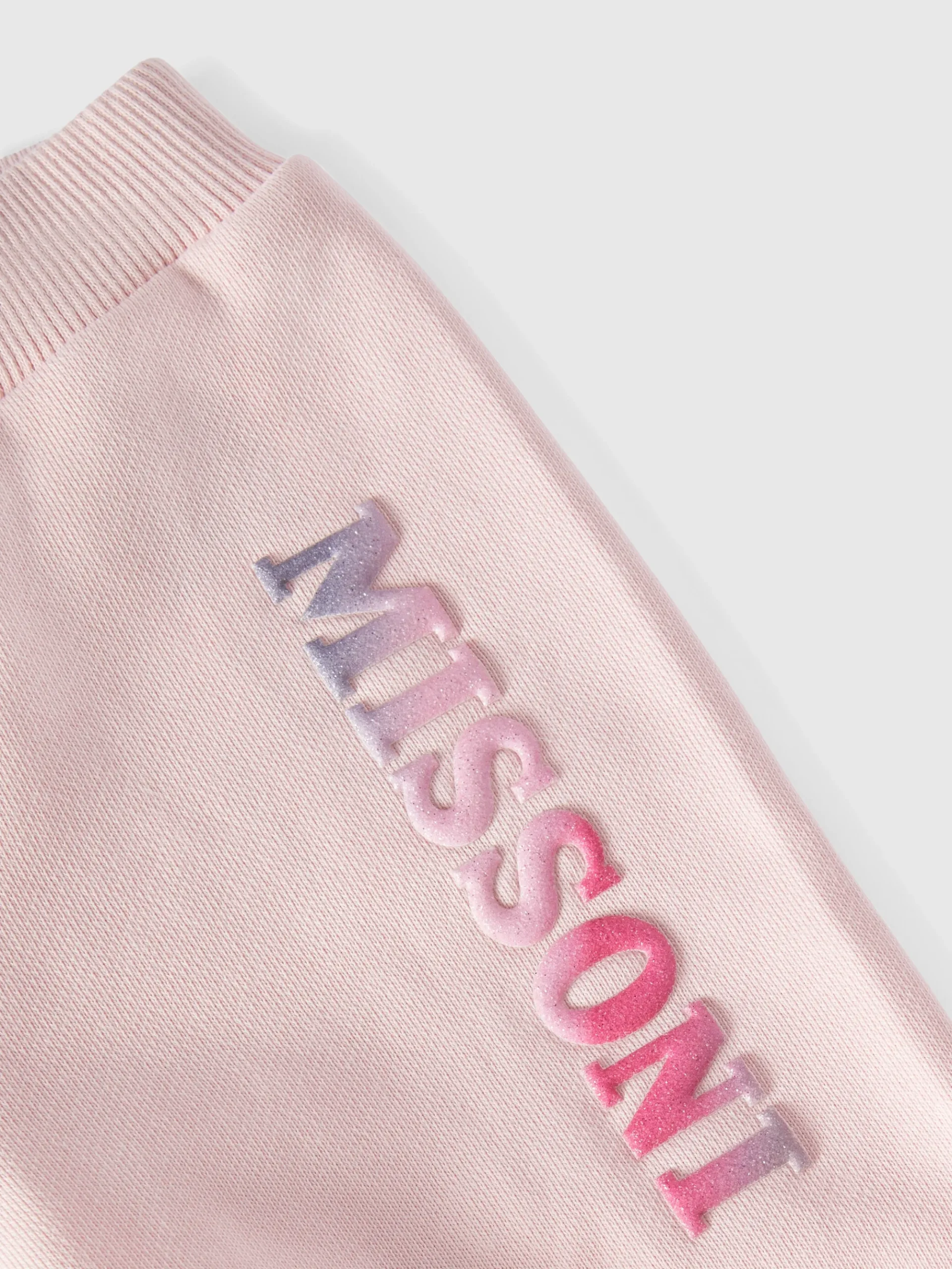 Cotton joggers with ruffles on the bottom and logo