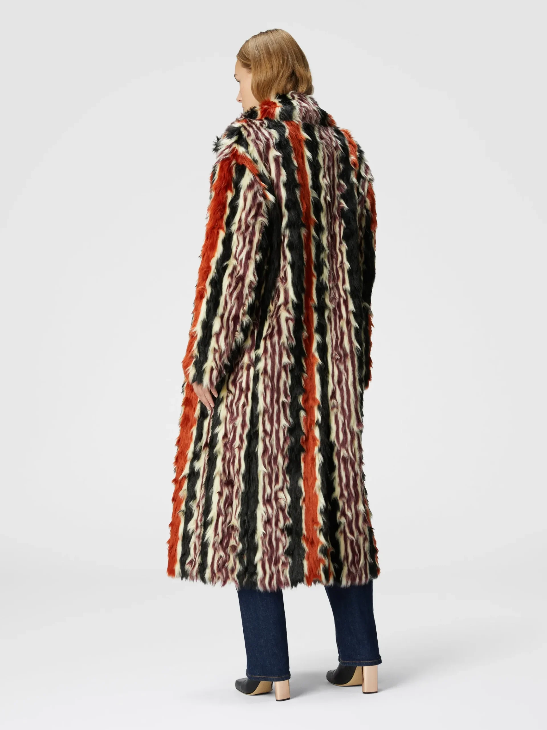 Long coat in striped faux fur