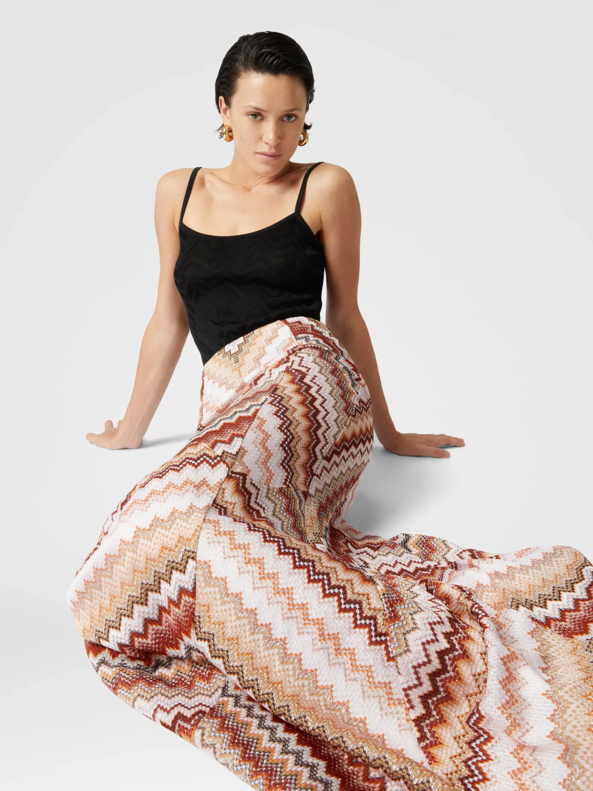 Long flared skirt with lamé serrated zig zag pattern
