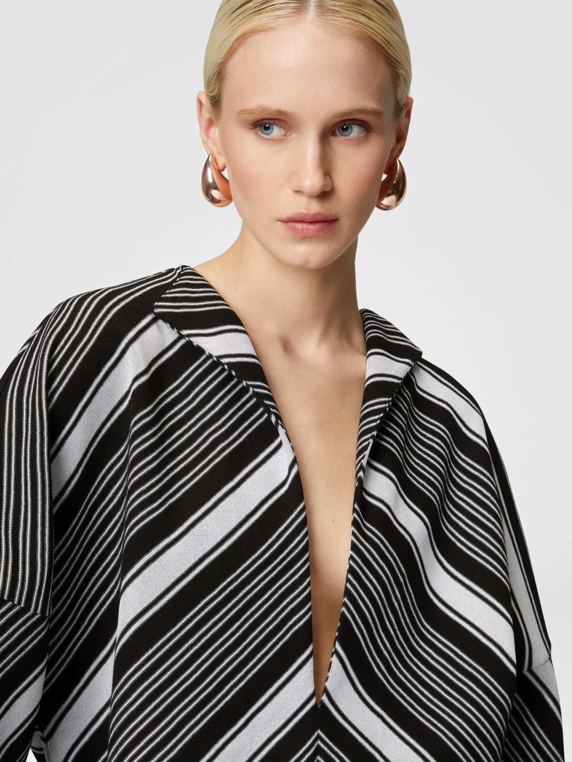 Mini-dress with oversized sleeves and plunging V-neckline