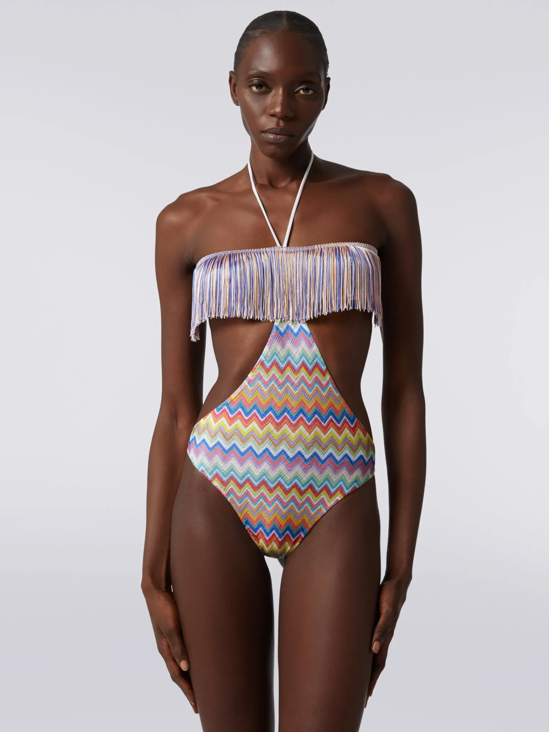One-piece swimming costume with zigzag print and fringes