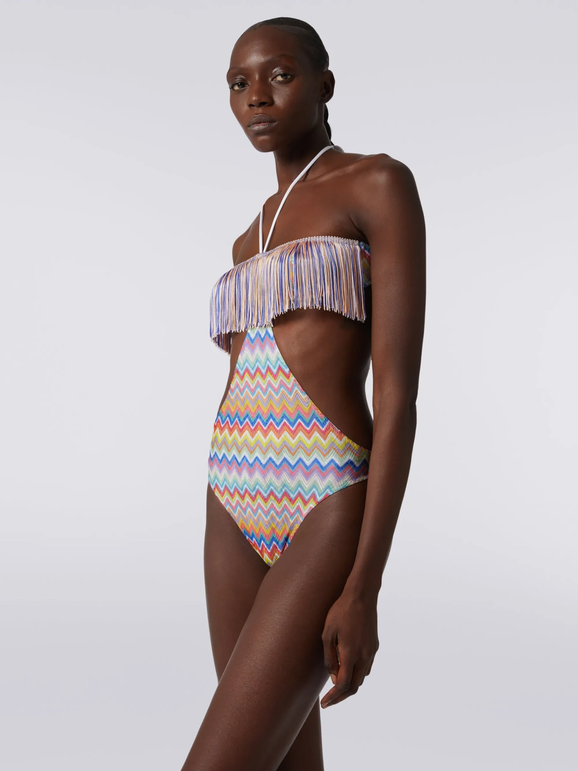 One-piece swimming costume with zigzag print and fringes