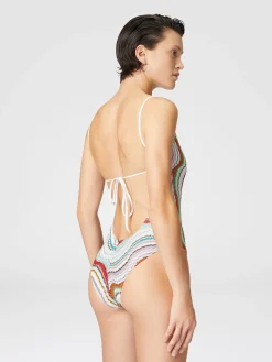 One-piece swimsuit with lamé wave pattern