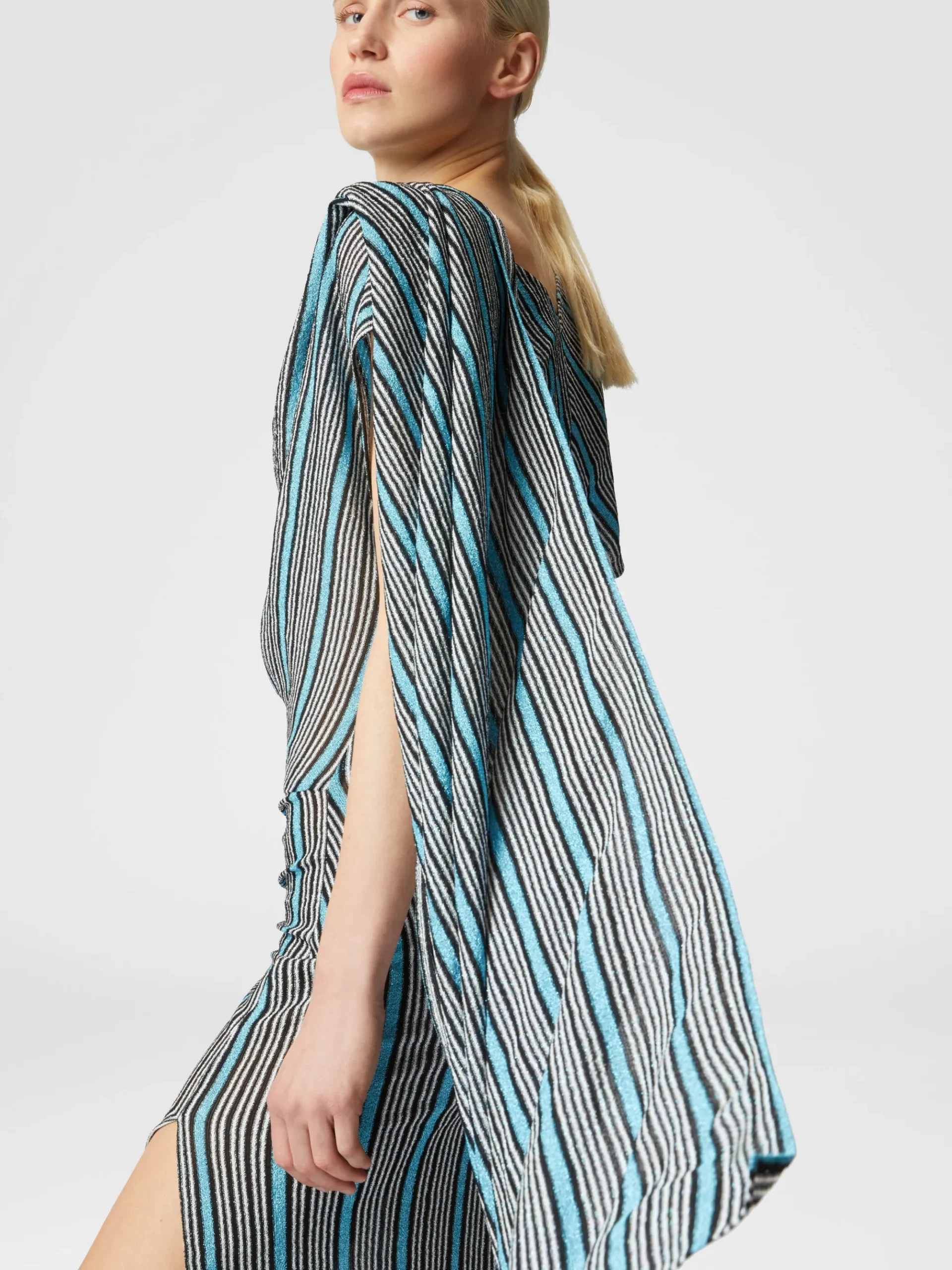 Peplum-cut dress in lamé viscose with side slit
