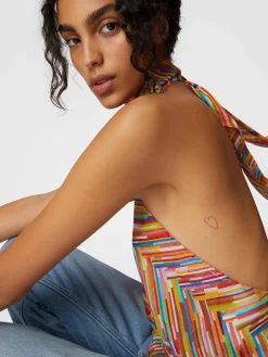Sleeveless turtleneck top in printed cotton and silk blend