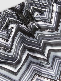 Swim shorts with zigzag print and drawstring waist