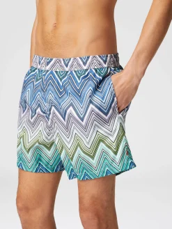 Swimming trunks with large zigzag print